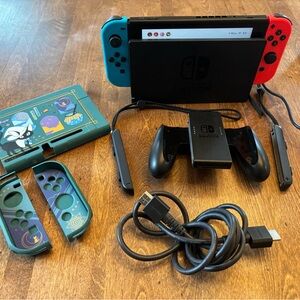 Nintendo Switch Console with Red & Blue Joy-Con and Themed Accessories